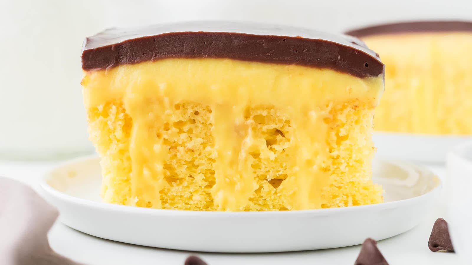 Boston Cream Poke Cake by Cheerful Cook.