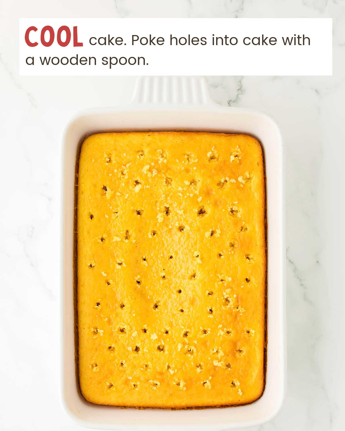 Bake cake with holes poked into it in a baking dish.