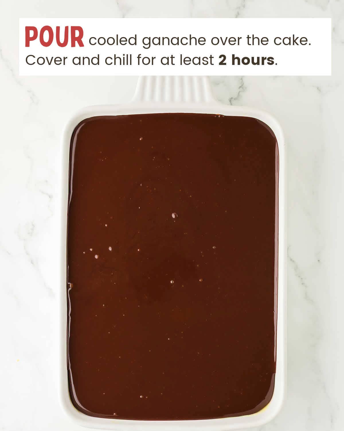 Chocolate ganache layer of a Boston Cream Poke Cake in a baking dish.