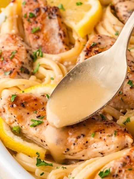 Drizzling sauce over Chicken Scampi.
