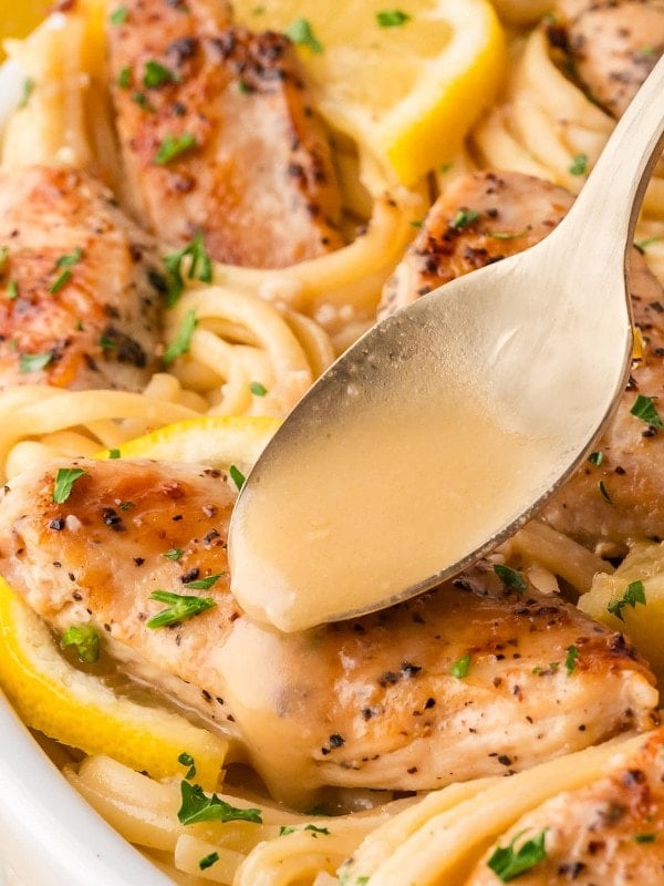 Drizzling sauce over Chicken Scampi.