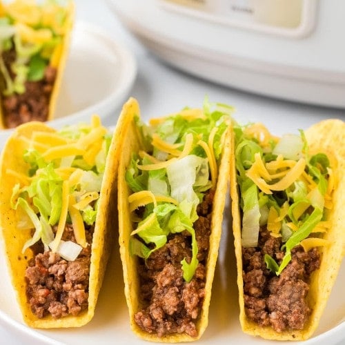 Crockpot Taco Meat in a hard taco shell.