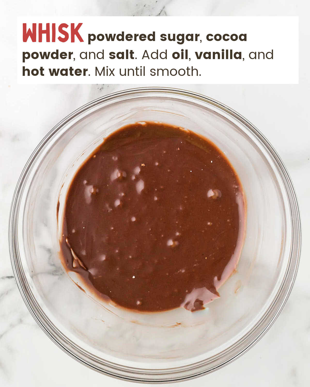 Chocolate icing in a mixing bowl.