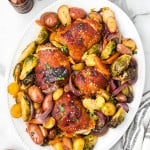 Honey Sriracha Chicken served on a white plate.