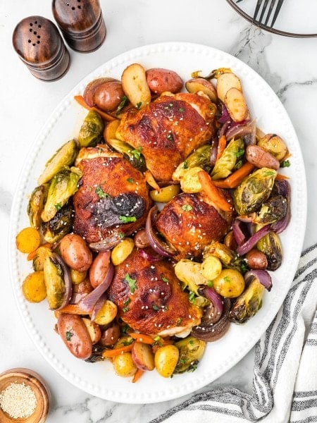 Honey Sriracha Chicken served on a white plate.