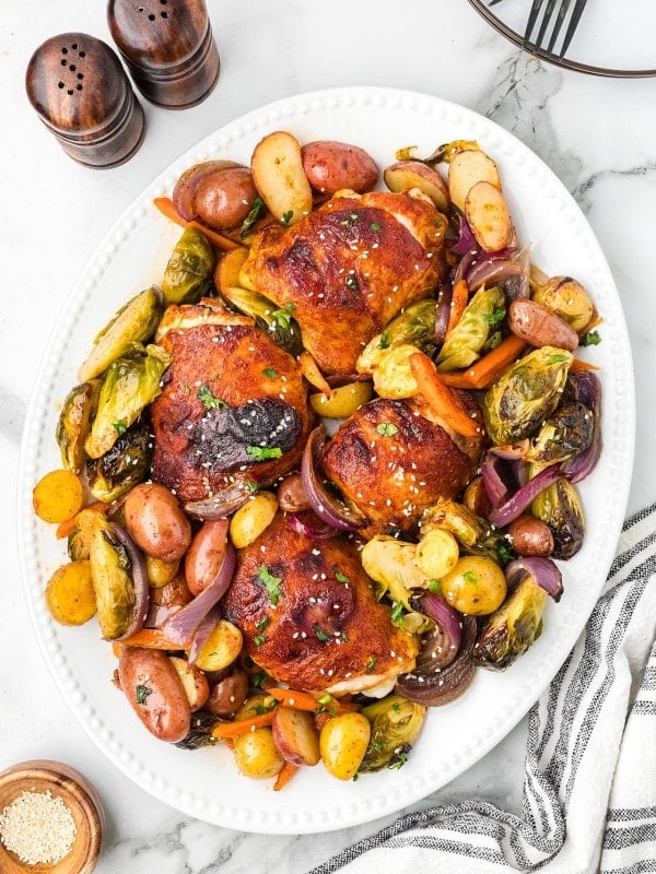 Honey Sriracha Chicken served on a white plate.
