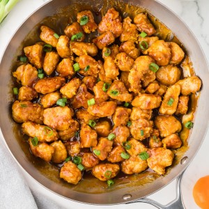 Topdown view of a skillet of homemade Orange Chicken.