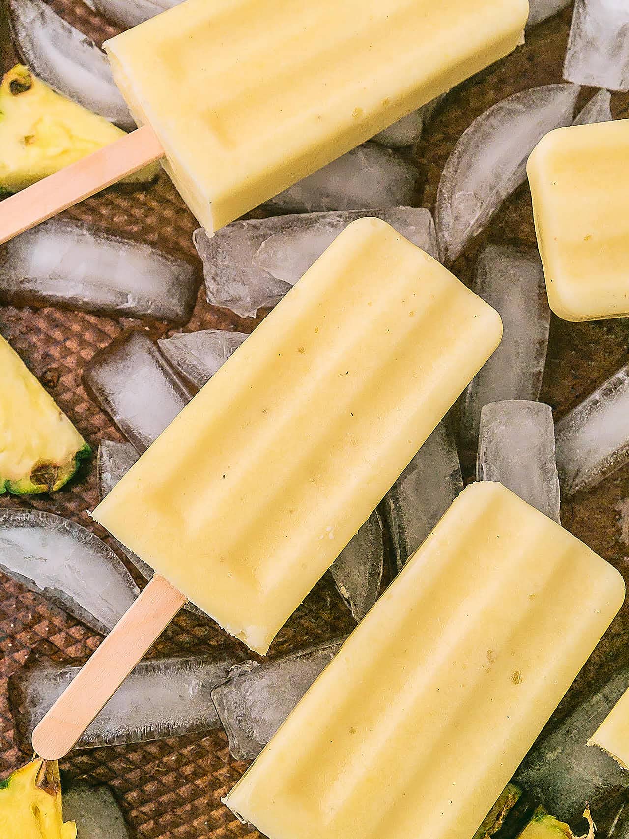 Pineapple Popsicles served over ice.
