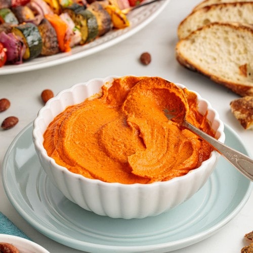 Romesco sauce served in a white bowl.