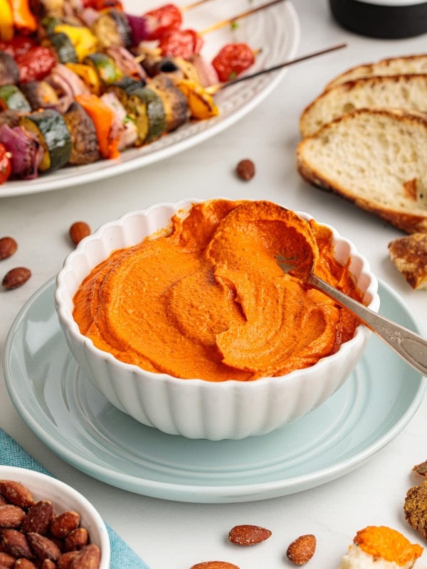 Romesco sauce served in a white bowl.