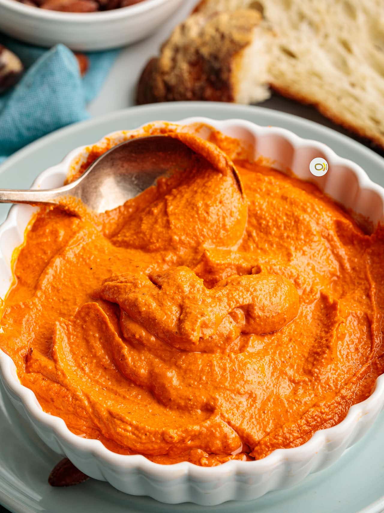 Romesco sauce in a spoon.