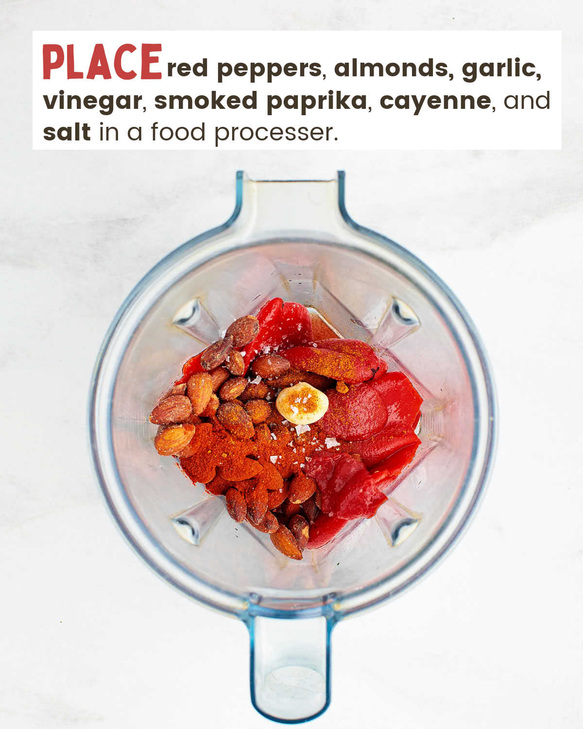 Red peppers, almonds, garlic, vinegar, and spices in a blender. 