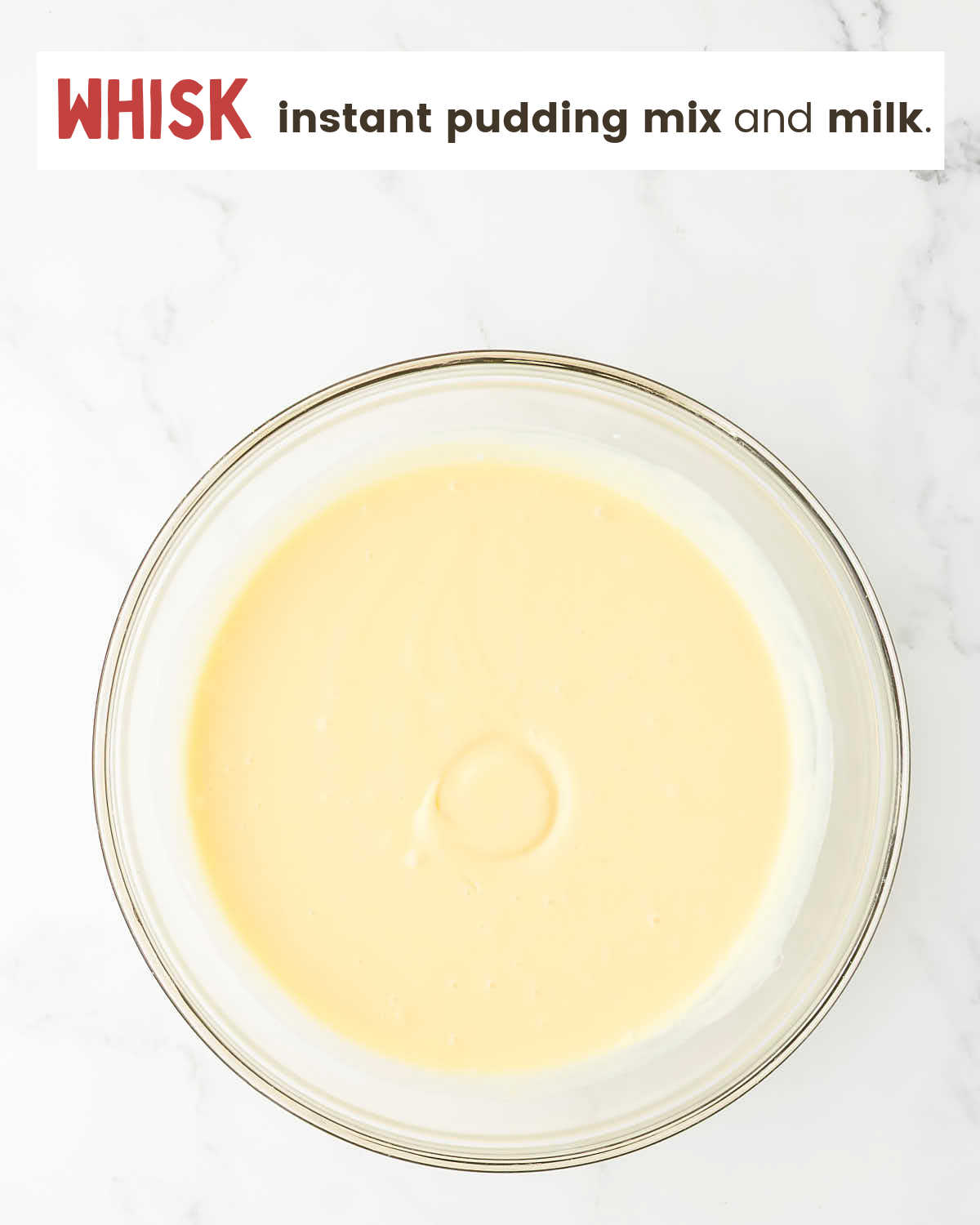 Mixed instant pudding mix and milk in a large bowl.