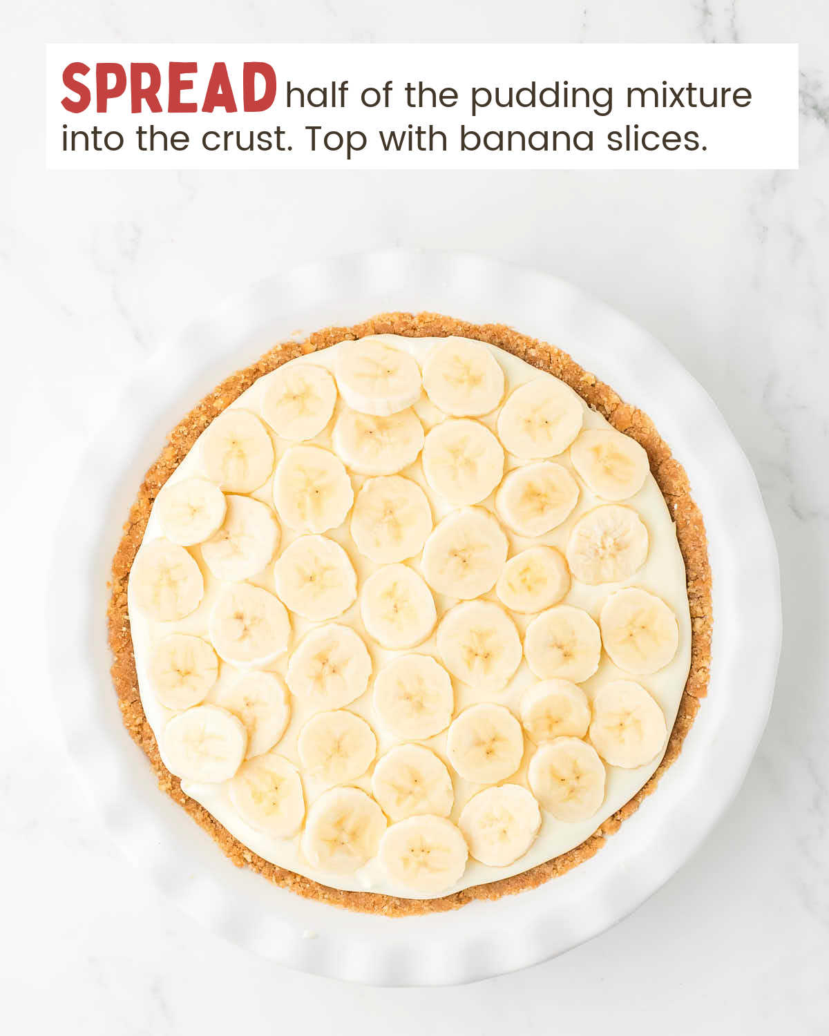 Banana cream pie with sliced bananas on top.