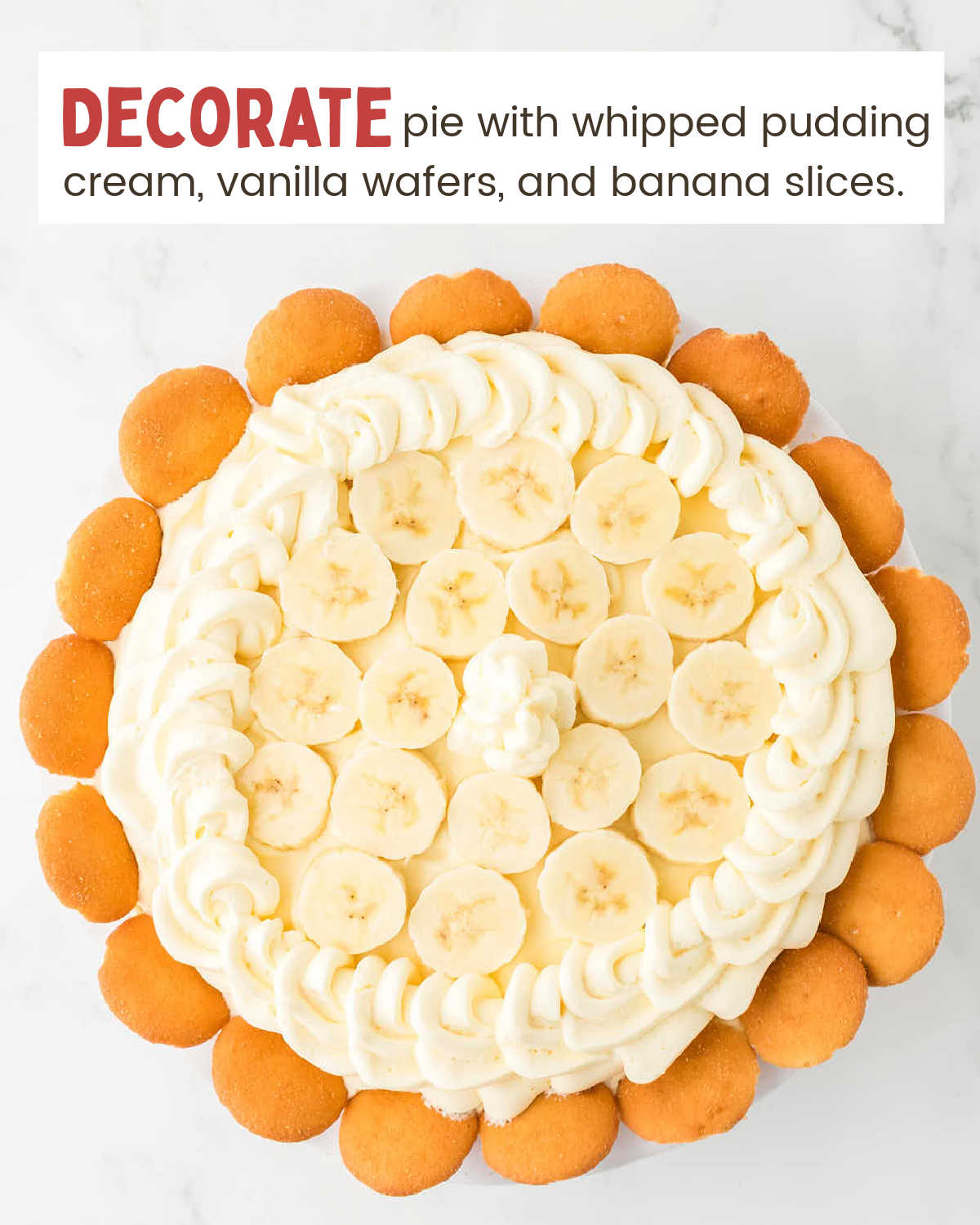 Banana Cream Pie decorated with sliced bananas and whipped pudding cream and wafers.