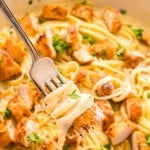 Blackened Chicken Alfredo with parsley and cheese.
