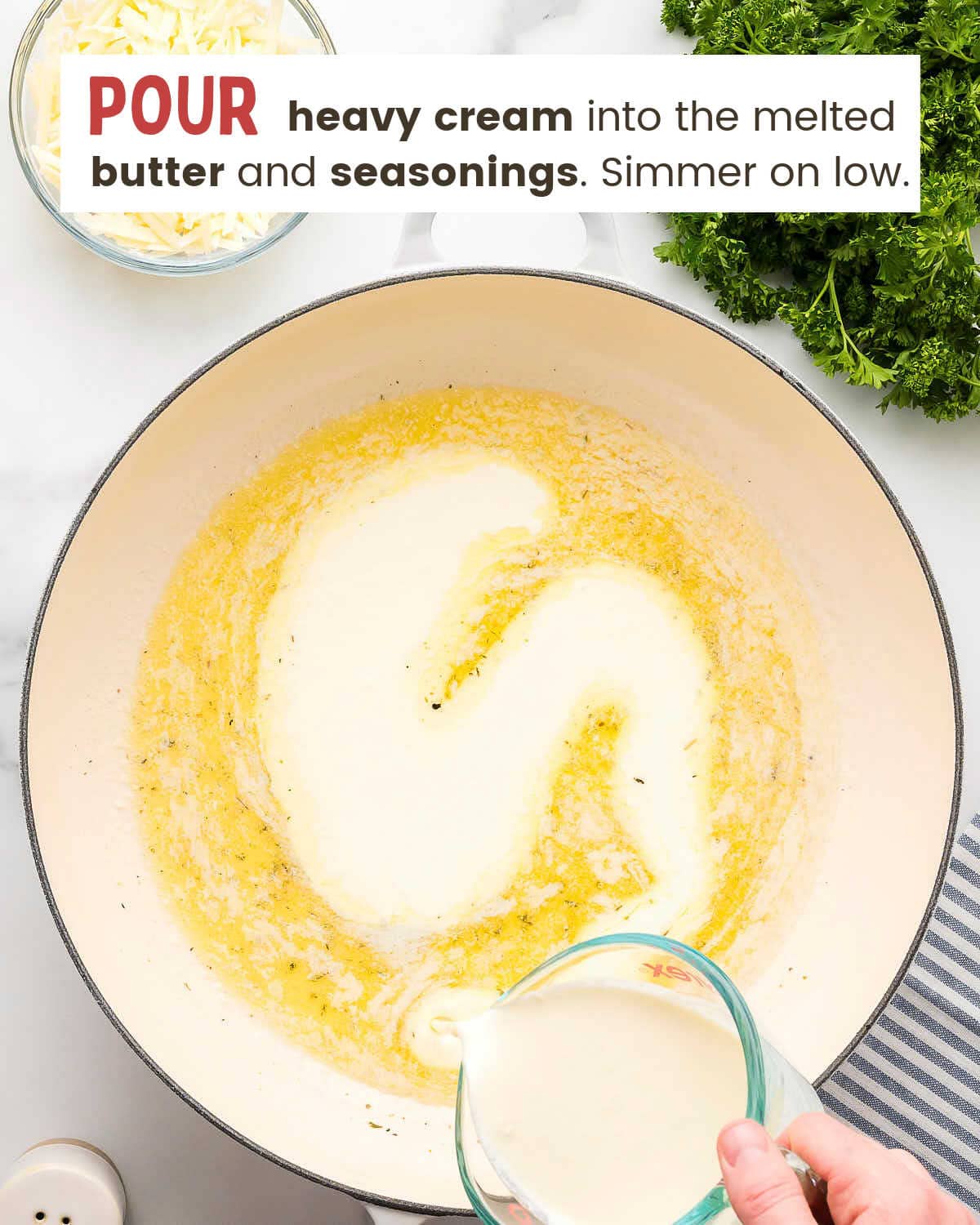 Heavy cream being poured into melted butter for Alfredo sauce.