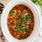 Chicken Tortilla Soup in a white Crockpot.