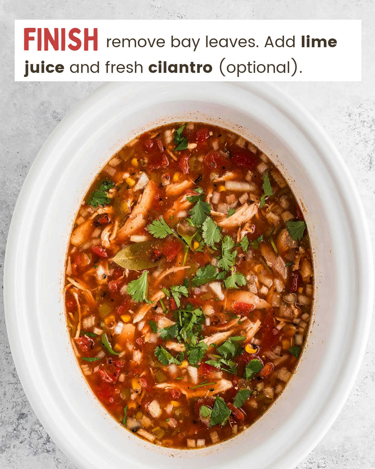 Cooked Crockpot Chicken Tortilla Soup garnished with fresh cilantro.