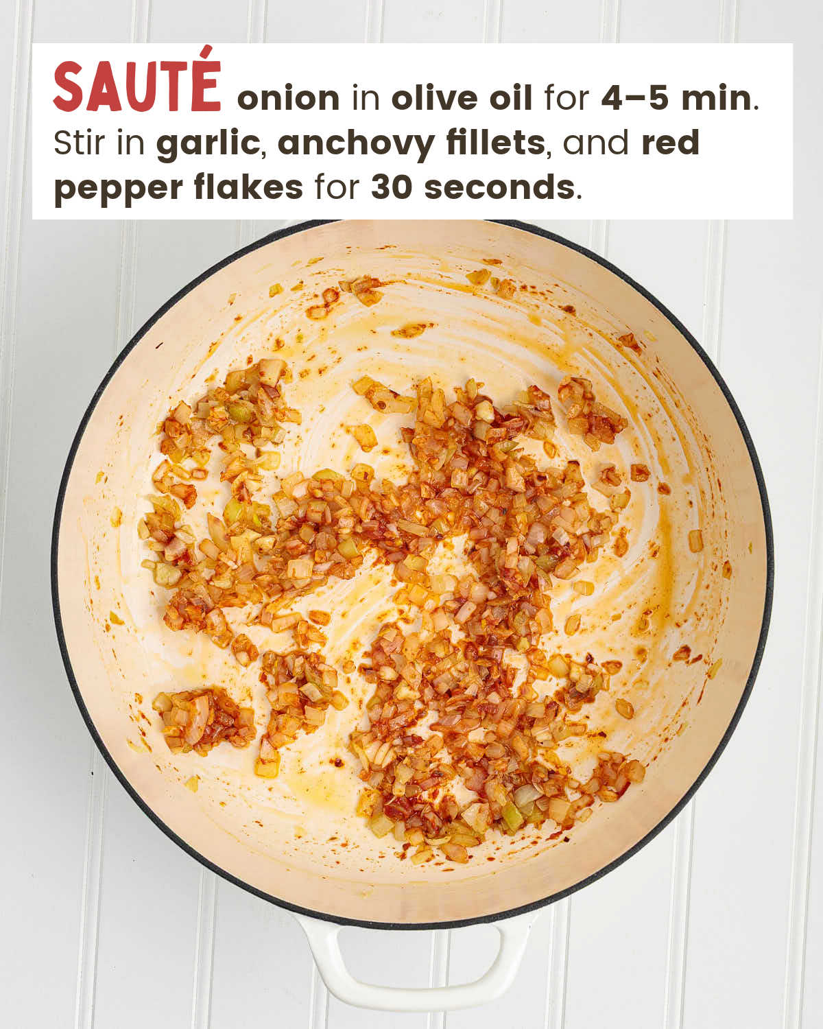 Sautéed onion, garlic, anchovy fillets, and red pepper flakes in a skillet.