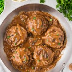 Topdown view of Salisbury Steak in an skillet.