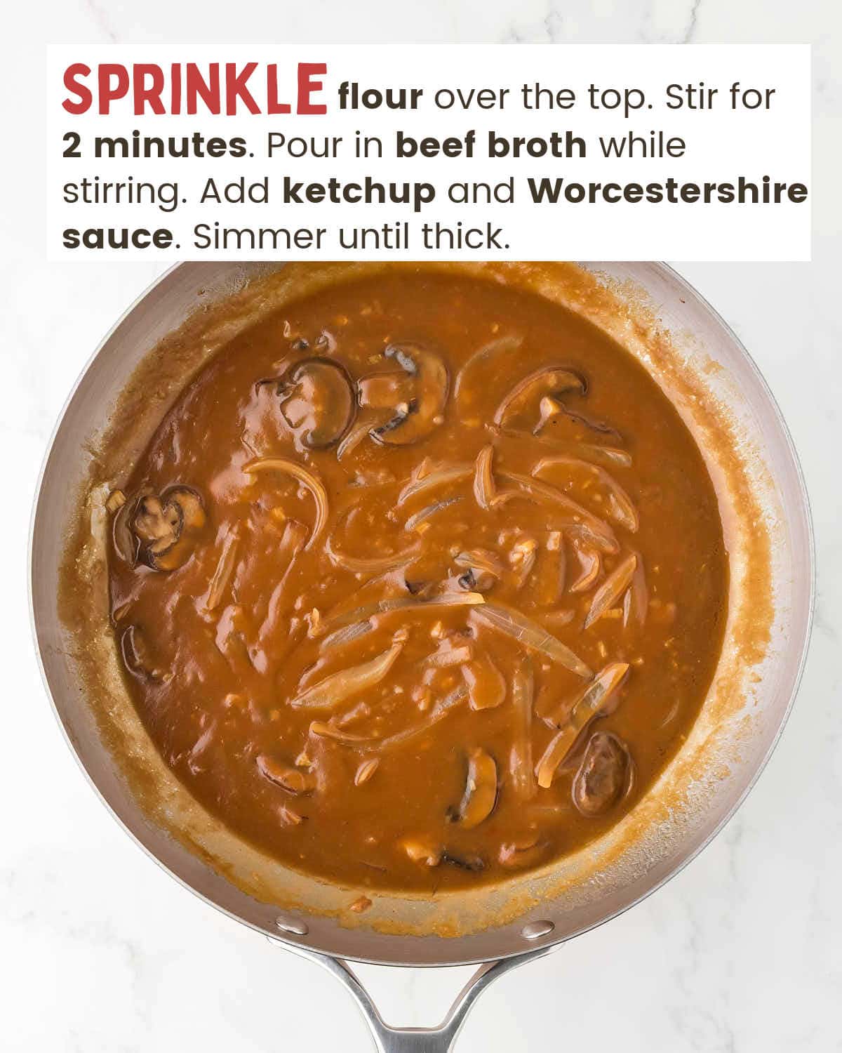 Beef broth gravy over onions and mushrooms in a skillet.
