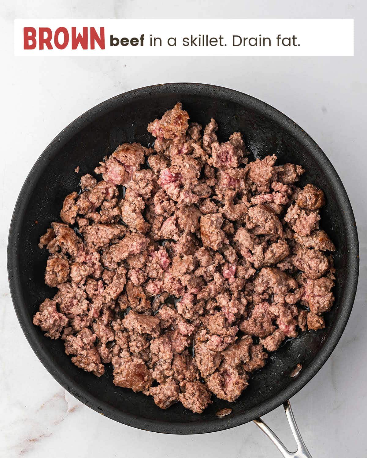 Ground beef in a skillet. 