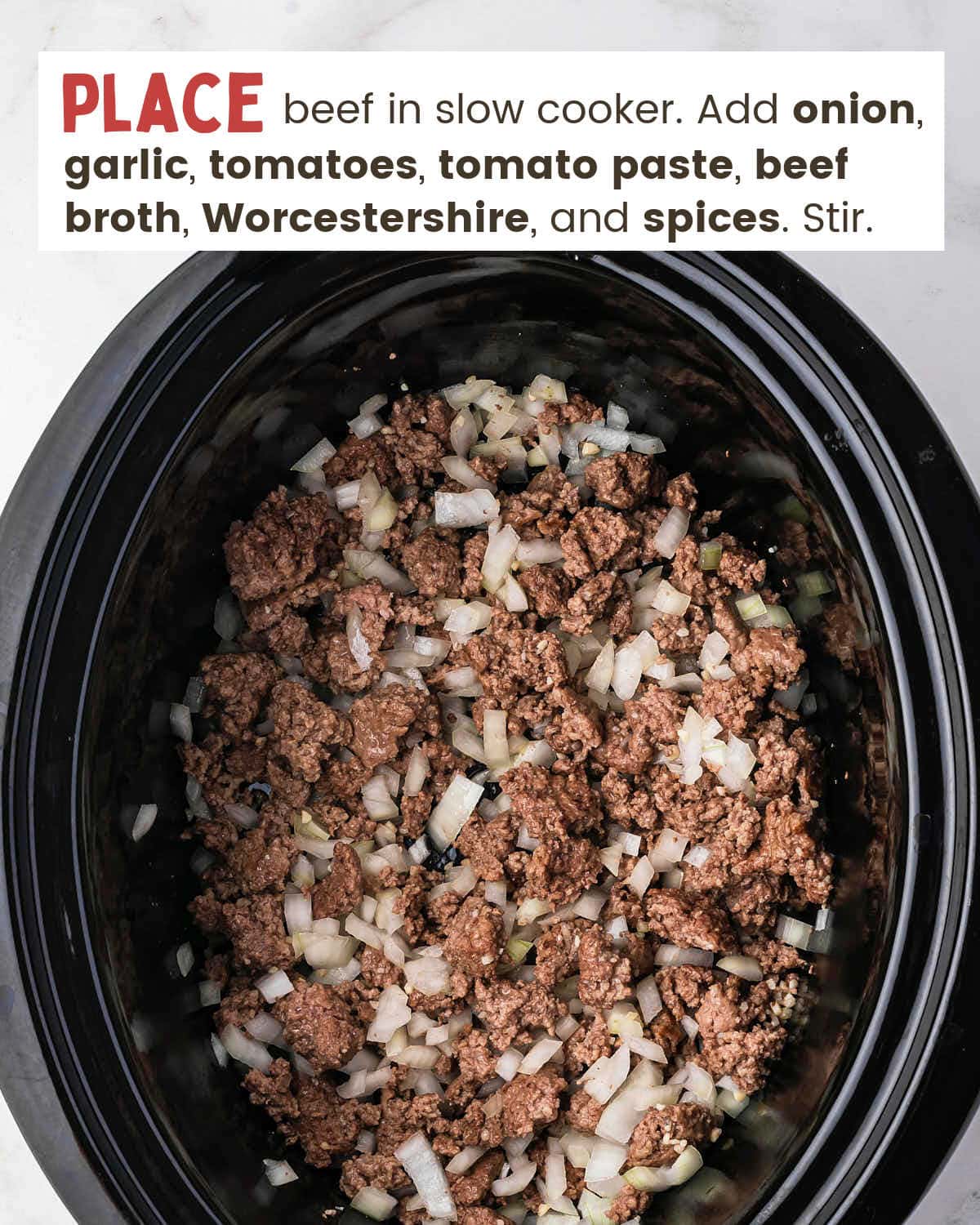 Cooked ground beef and onions in a slow cooker.