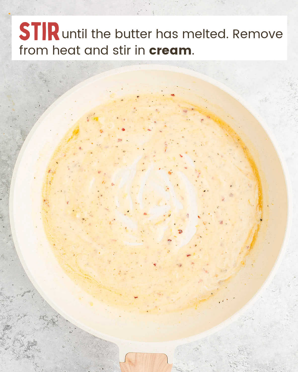 A creamy pasta sauce in a skillet.
