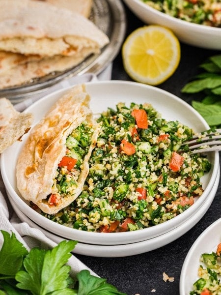 A bowl of Tabouli (Tabbouleh salad) and pita.