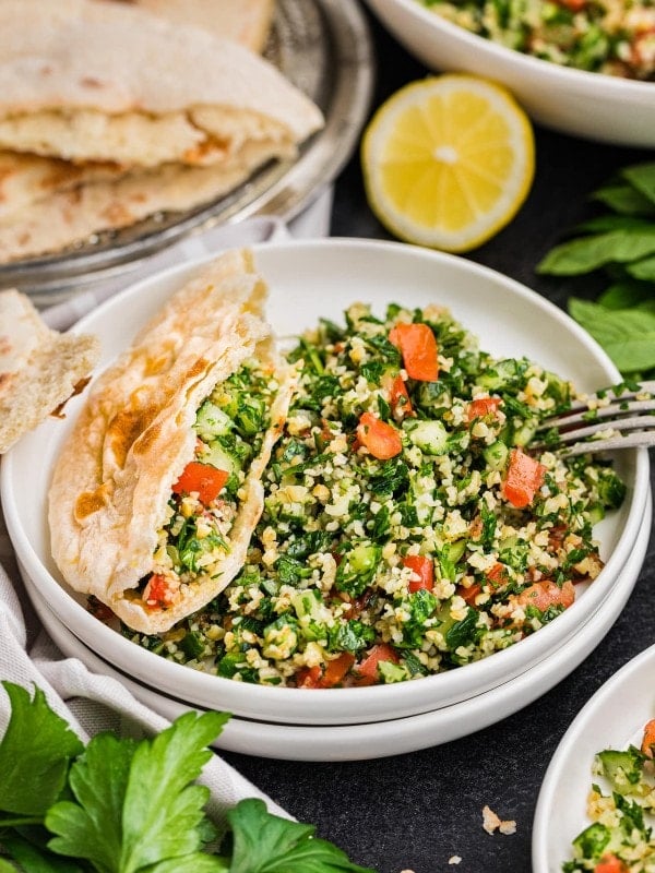 A bowl of Tabouli (Tabbouleh salad) and pita.