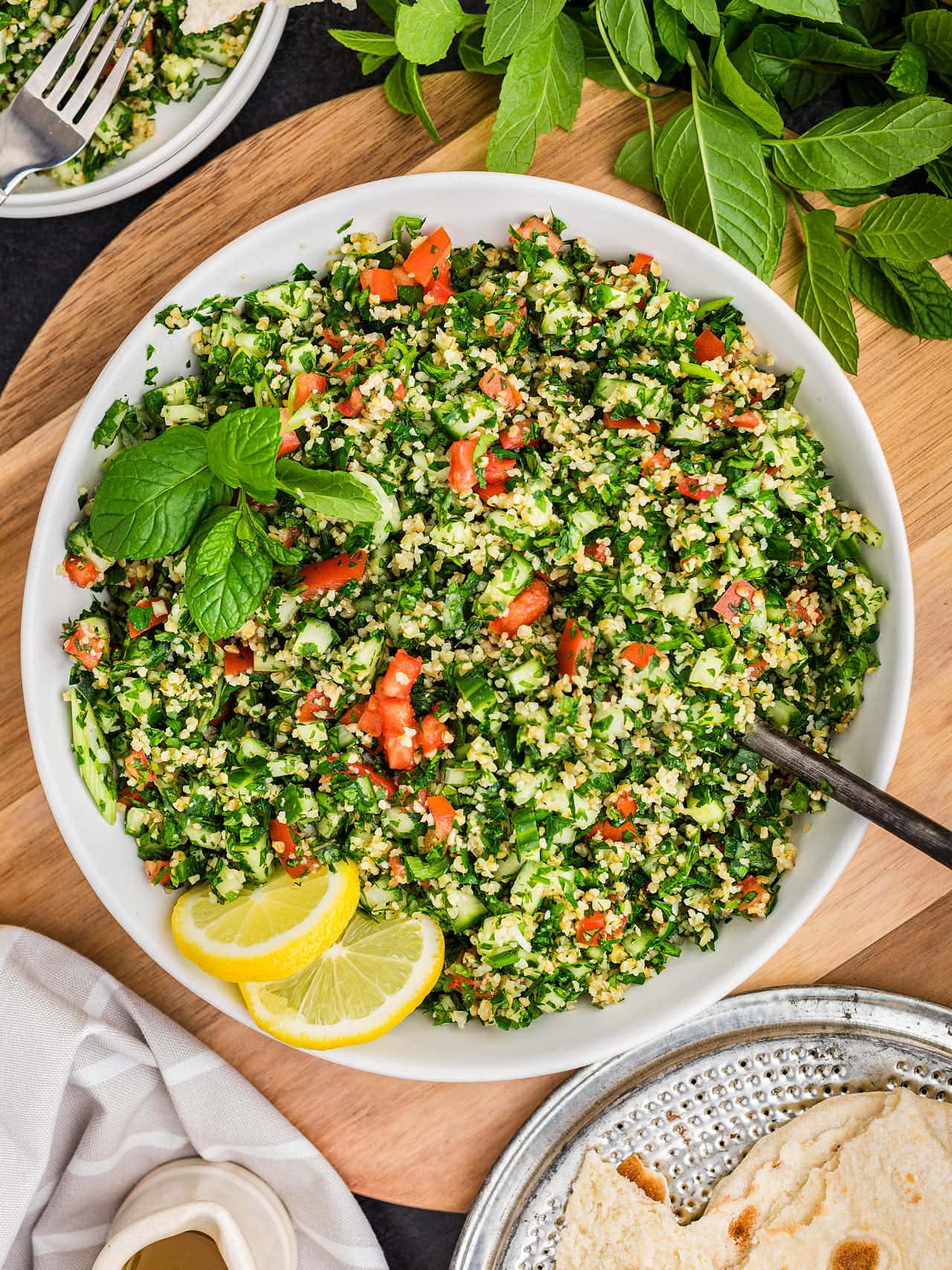 Top down view of Tabouli (Tabbouleh Salad) on a white plate.