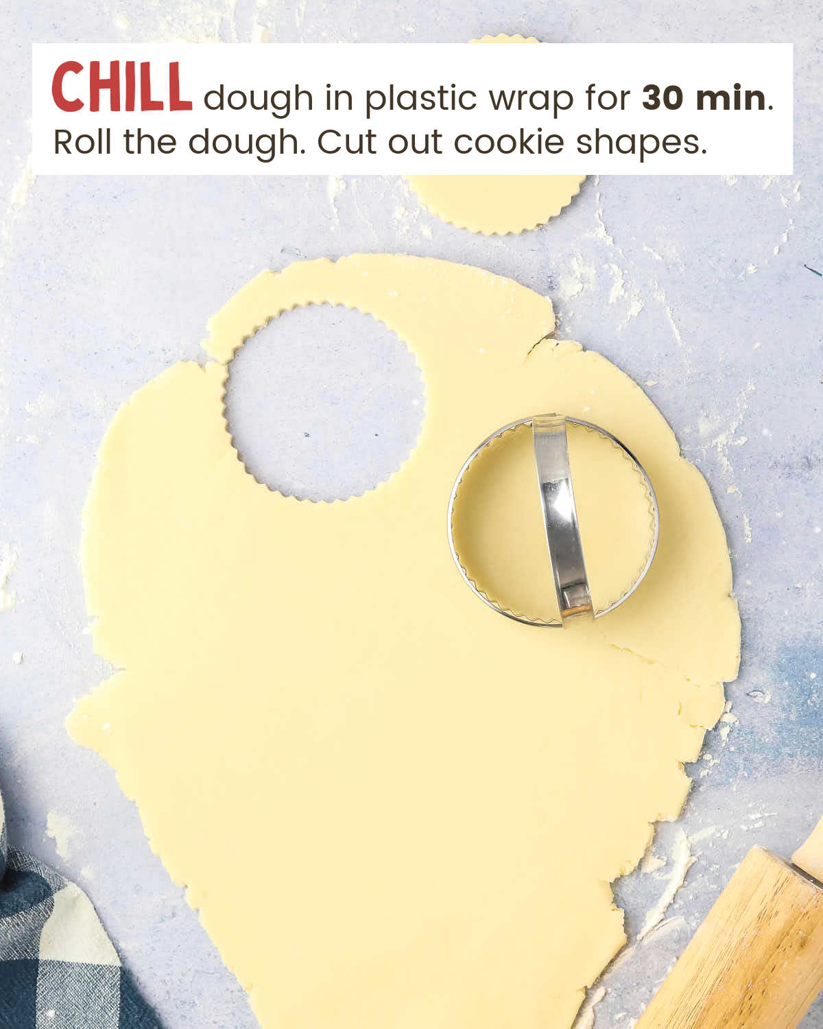 Rolled cookie dough with a round cookie cutter.