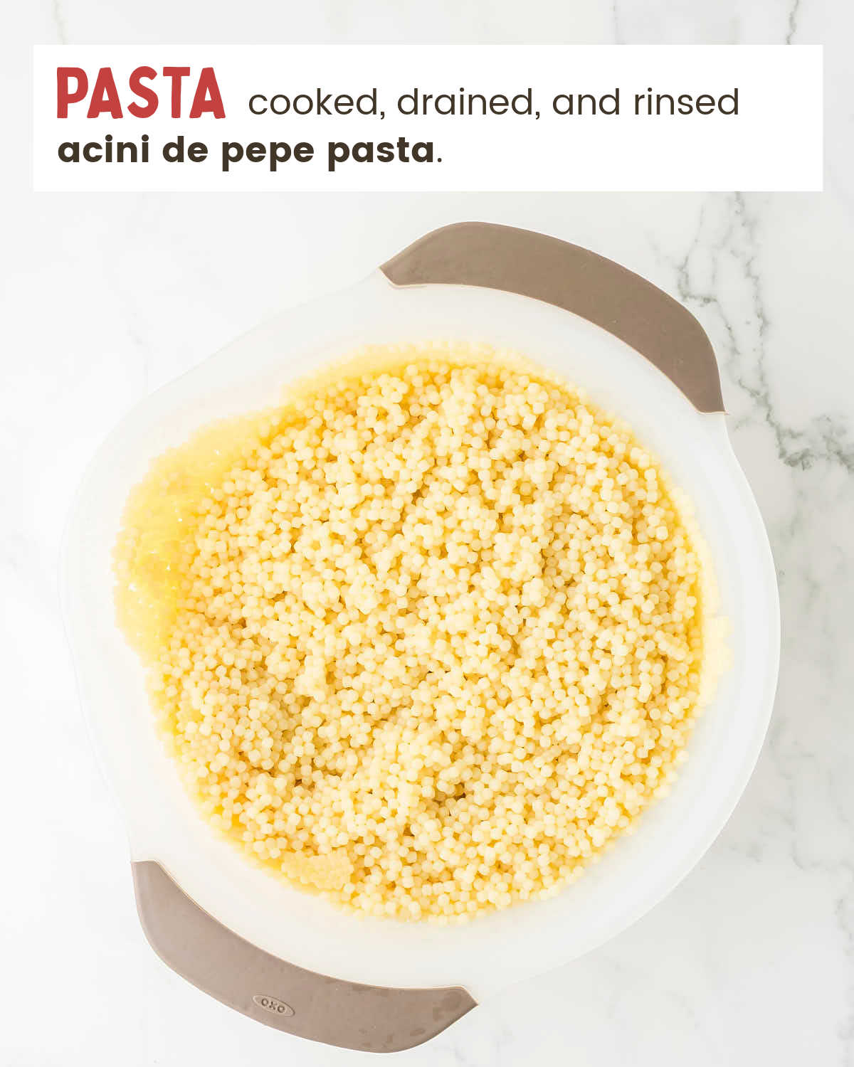 Cooked acini de pepe pasta in a colander.