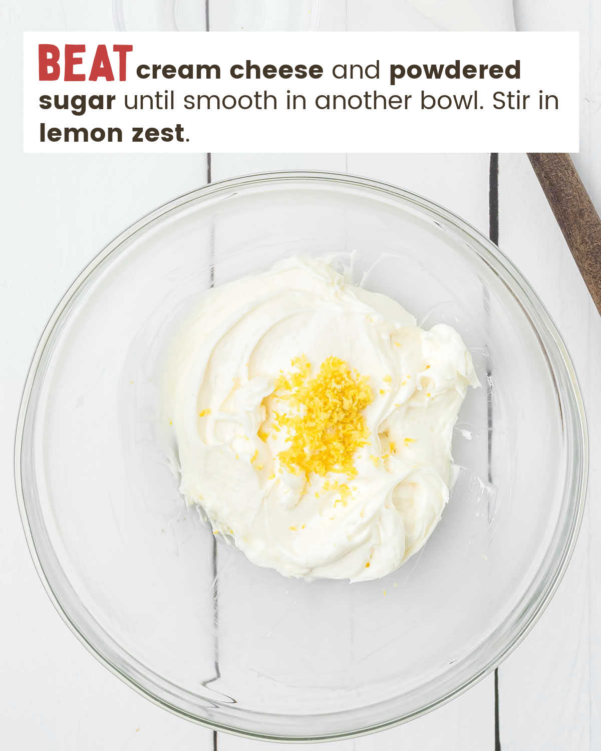 Cream cheese mixture topped with lemon zest in a bowl.