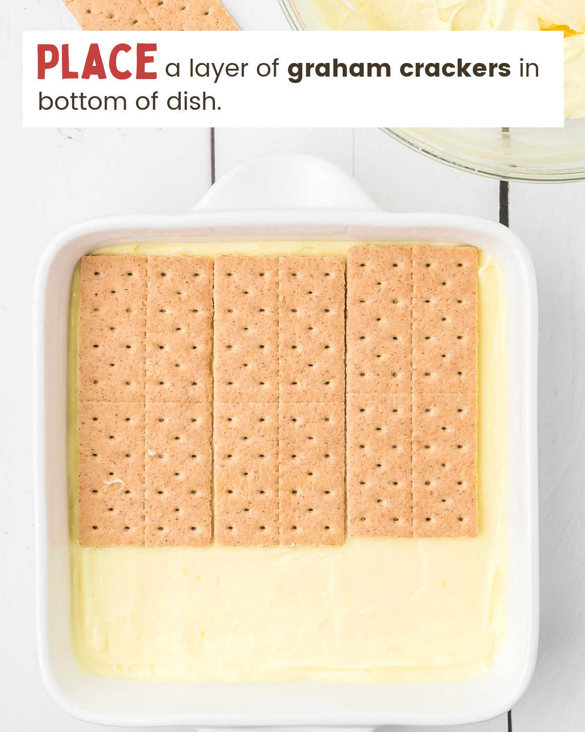 A dish with a pudding mixture topped with three Graham cracker sheets.