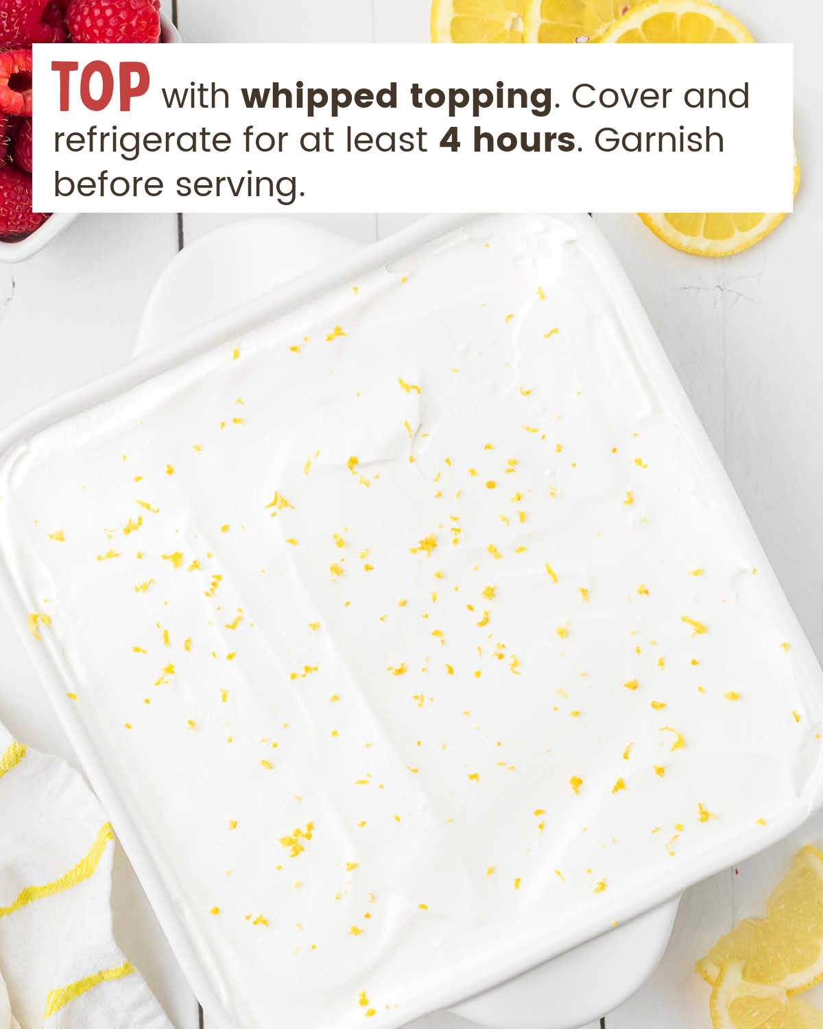 Lemon icebox cake garnished with lemon zest in a dish.