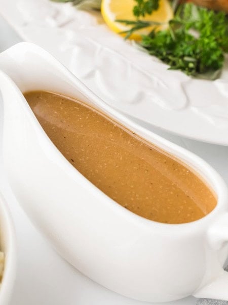 A gravy boat of made-from-scratch Turkey Gravy for a Thanksgiving Turkey.