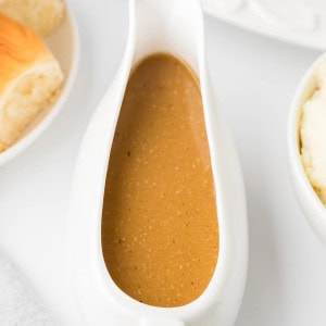 A gravy boat of made-from-scratch Turkey Gravy for a Thanksgiving Turkey.
