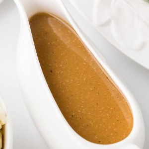 A gravy boat of homemade Turkey Gravy for a Thanksgiving Turkey.