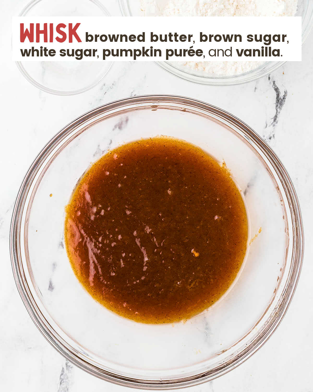 Whisked brown butter mixture in a glass bowl. 