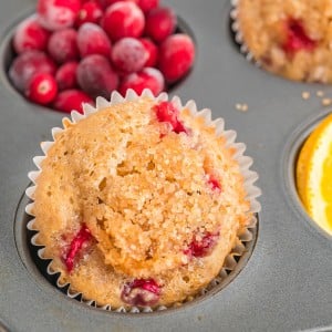 Closeup of Cranberry Orange Muffins in a muffin tin.