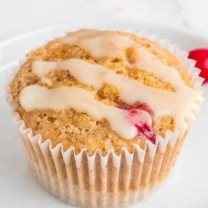Closeup of a glazed Cranberry Orange Muffin.