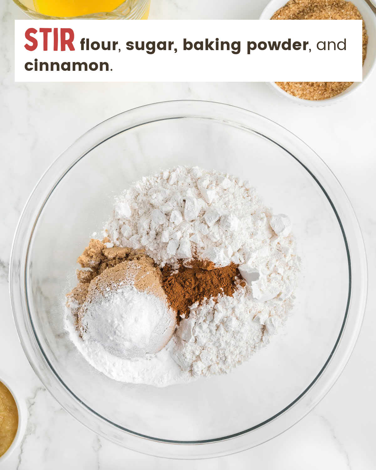 Flour, baking soda, cinnamon, and sugar in a glass bowl.
