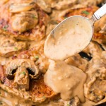 Closeup of Cream of Mushroom Pork Chops in a cast iron skillet.