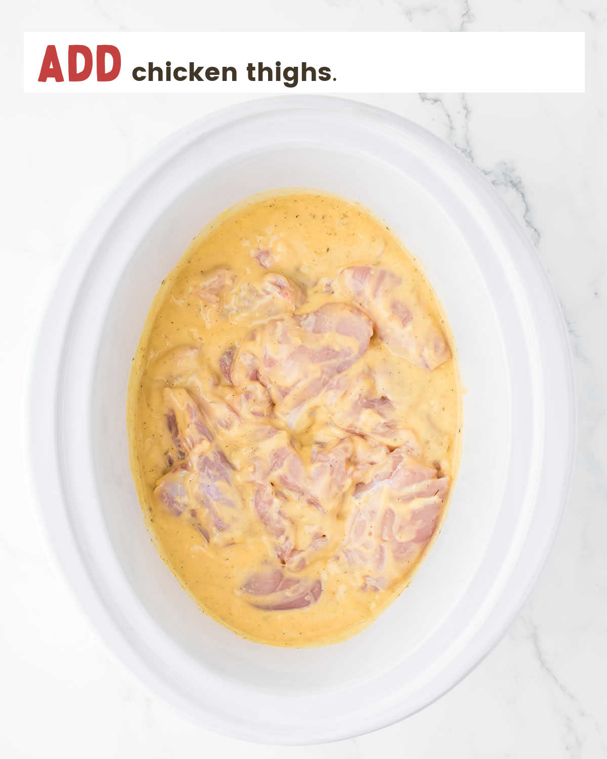 Chicken thighs in cream of chicken soup in a slow cooker.