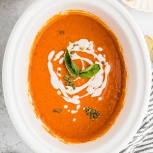 Pumpkin Soup made in a white Crockpot.
