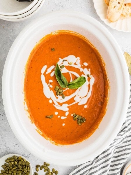 Pumpkin Soup made in a white Crockpot.