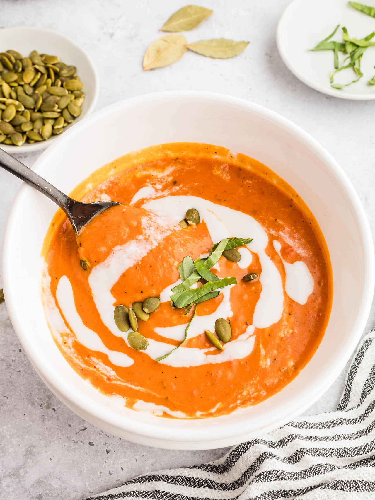 Crockpot Pumpkin Soup served in a white bowl.
