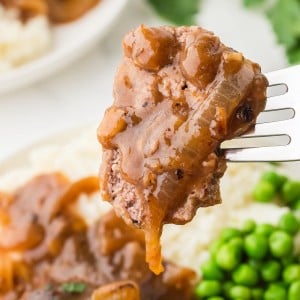 A forkful of Hamburger Steak.